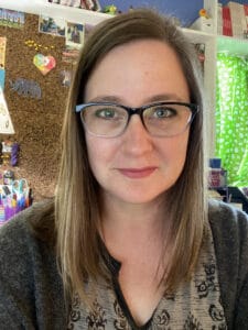 courtney glasses reduce glare 2 White woman in her mid-40s with glasses and shoulder length brown hair