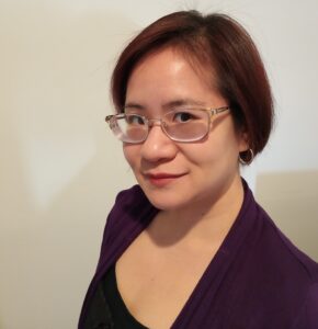 Diana Pho Headshot_No Credit Headshot of Diana Pho: a Vietnamese-American cis woman with a short bob haircut and silver glasses.